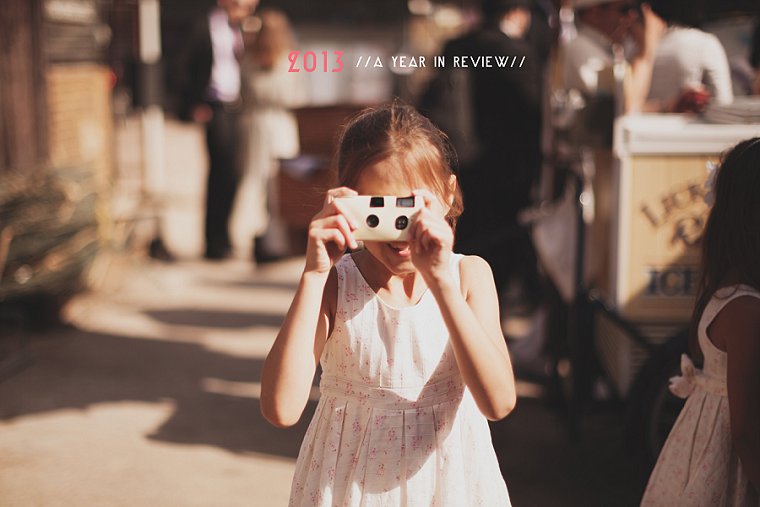 A young bridesmaid at a wedding in Whitstable Kent taking a photograph of wedding photographer Paul Fuller
