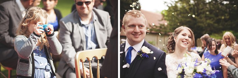 Young child taking a photo of the bride and groom