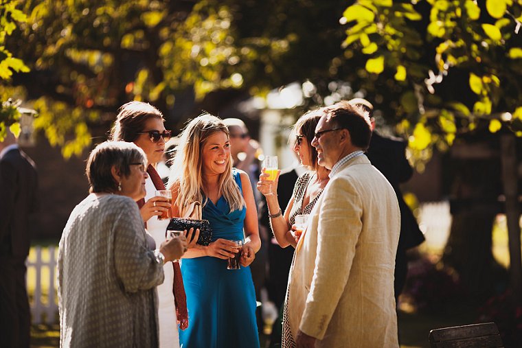 Wedding guests chatting and laughing during the wedding reception