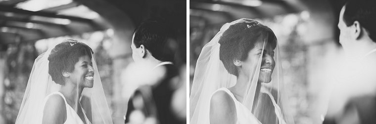 Bride laughing nervousy during the ceremony of her wedding at Chartwell House in Kent