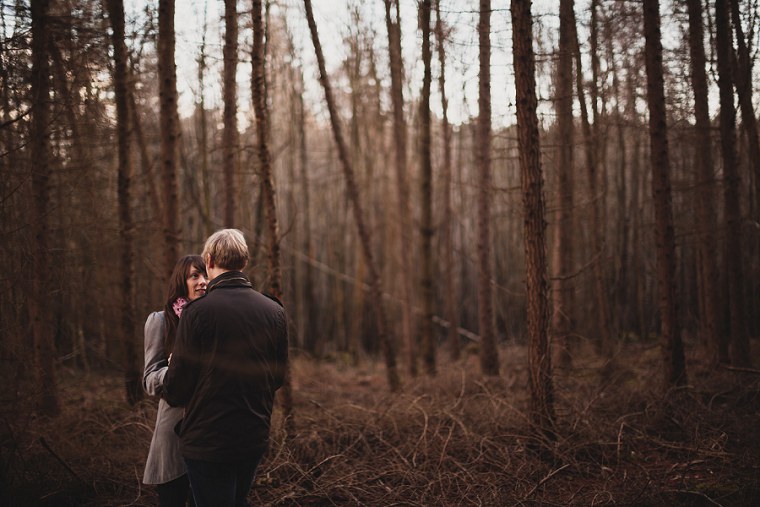 Kyla and Tom Pre Wedding Shoot at Bedgebury Forest in Kent 005 Kyla and Tom holding hands in a woodland area