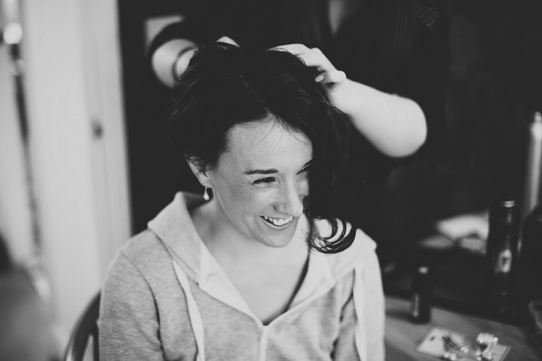 Bride having her hair done before her wedding day