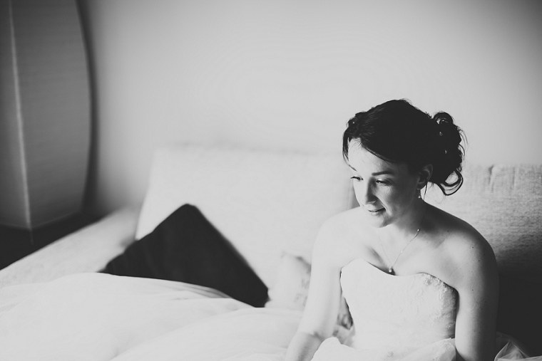 Black and White Photograph of a bride in her wedding dress waiting to leave for her wedding at Nettlestead Place in Kent