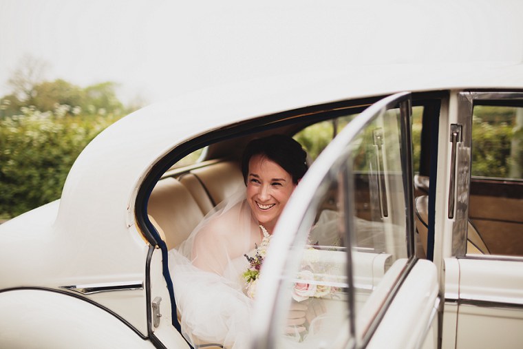 Bride exiting her wedding car