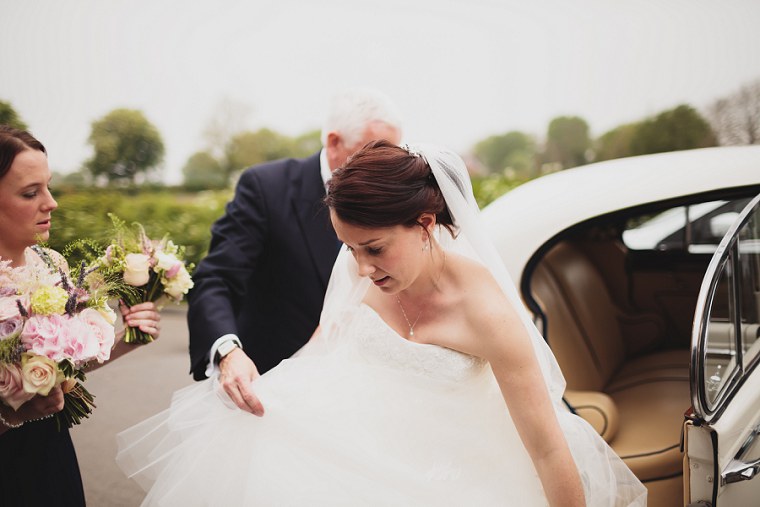 Bride making final preparations before the start of the wedding service