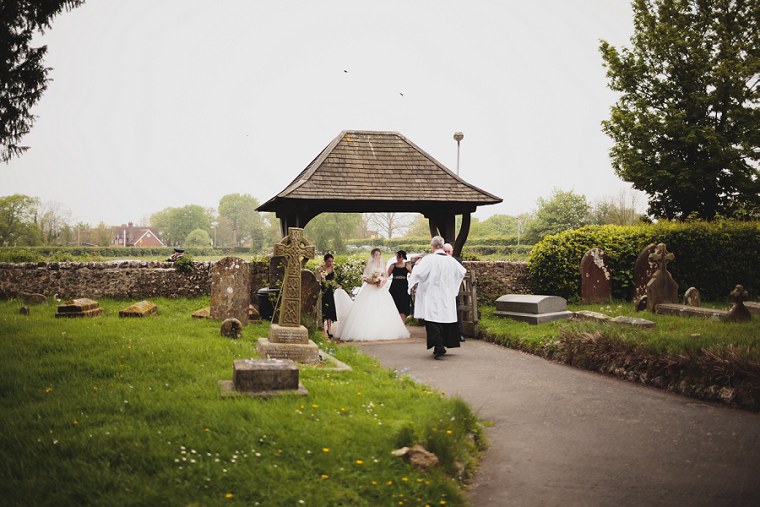Wedding party following the vicar of St Mary's church