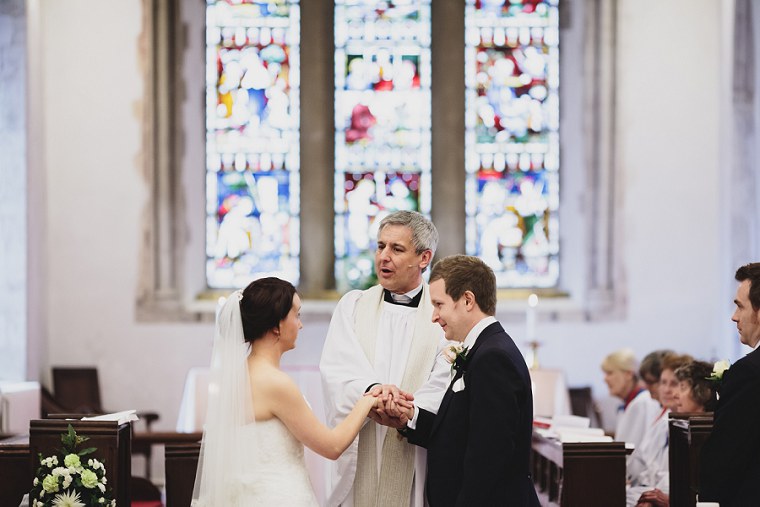 Vicar delivering service during wedding