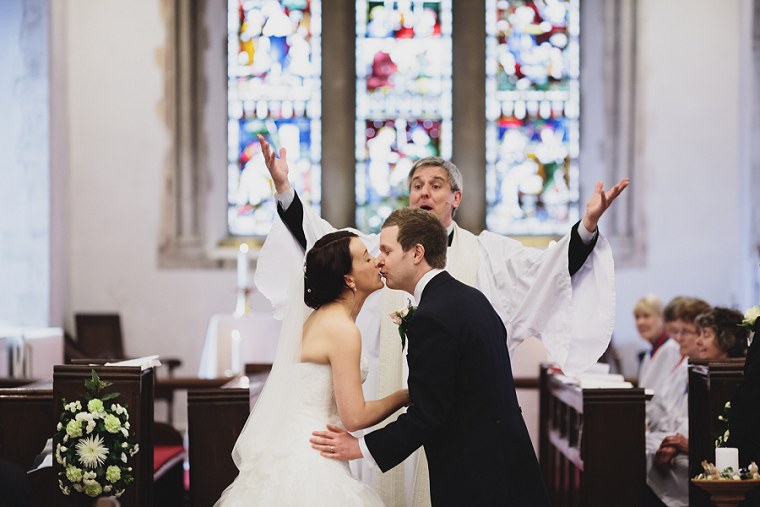 Bride and groom kiss
