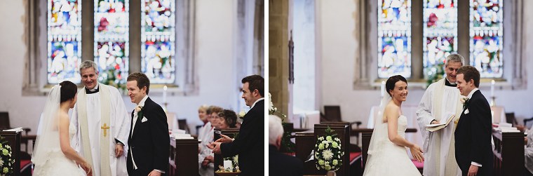 Bride and groom smiling and laughing after the end of their wedding service