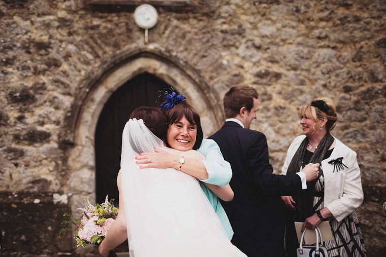 Mother of the bride hugging her daughter
