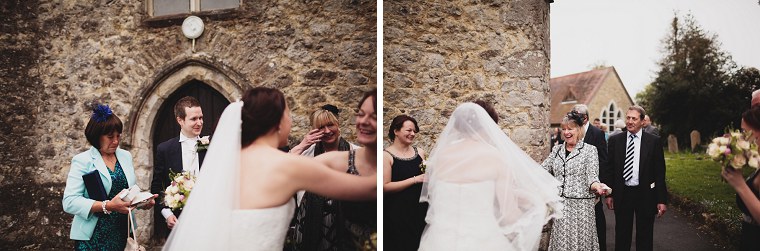 Wedding guests hugging the bride and groom