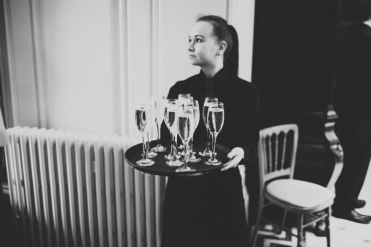 Waitress holding glasses of Champagne at Mount Ephraim
