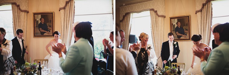 Wedding guests applauding wedding couple at the start of the wedding breakfast at Mount Ephraim Gardens in Kent