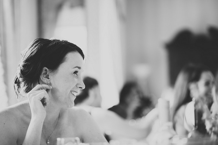 Black and White photograph of bride at Mount Ephraim Gardens smiling during the speeches