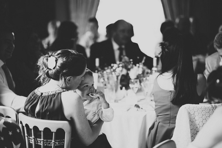 Bridesmaid holding her son at Mount Ephraim Gardens