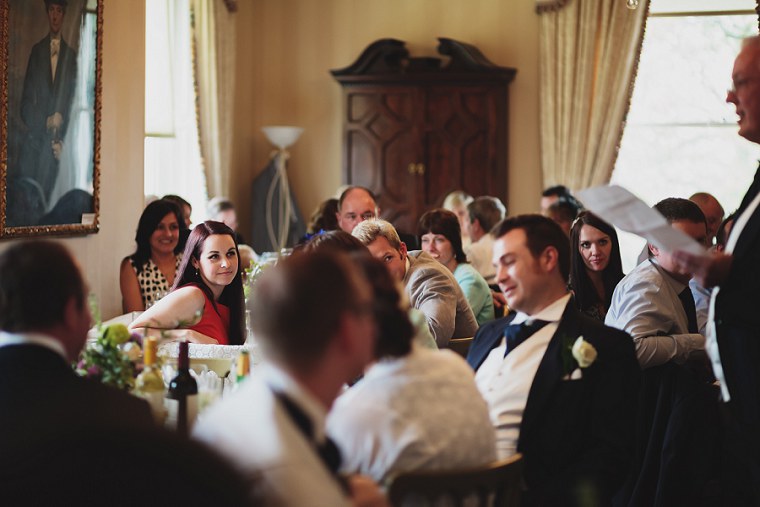 Wedding guest enjoying the speeches during the wedding breakfast