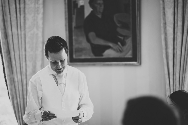 Black and white wedding photography of groom giving his speech at Mount Ephraim Gardens in Kent