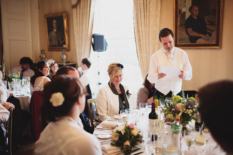 Mother of the groom laughing at the wedding speeches