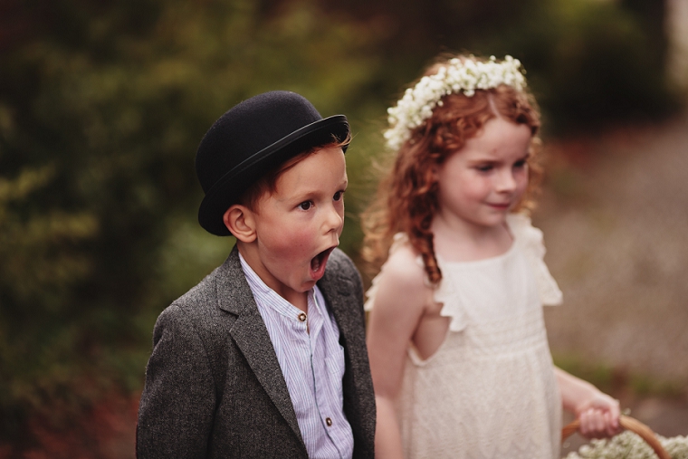 Page boy looking shocked at Tithe Barn in Lenham
