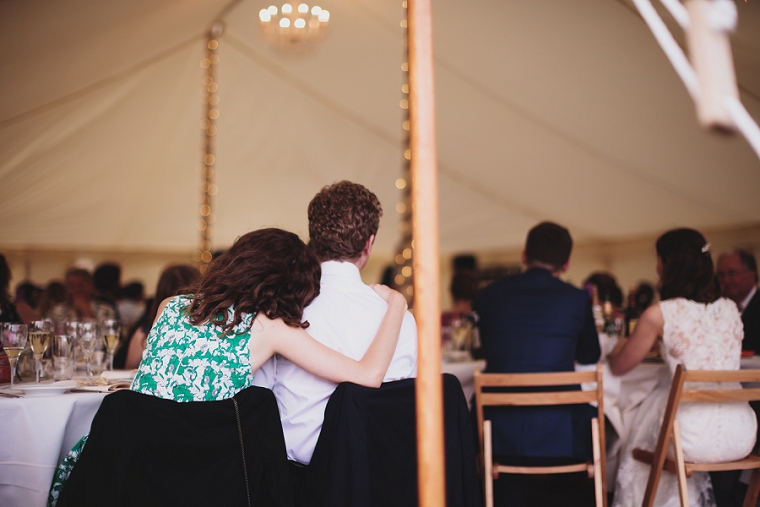two wedding guests hugging casual wedding photography at Mark Beech Falconhurst Estate in Kent